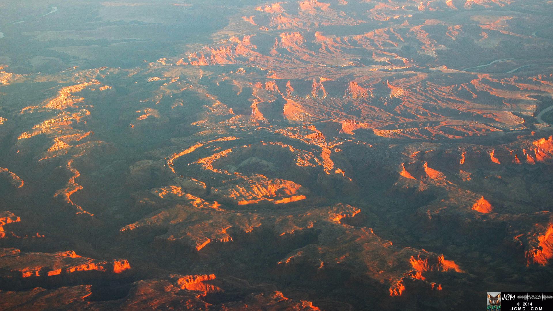MSP-LAX canyon terrain sunset ridges from airline window double crater rings
